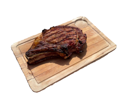 Prime rib on wood board by alban